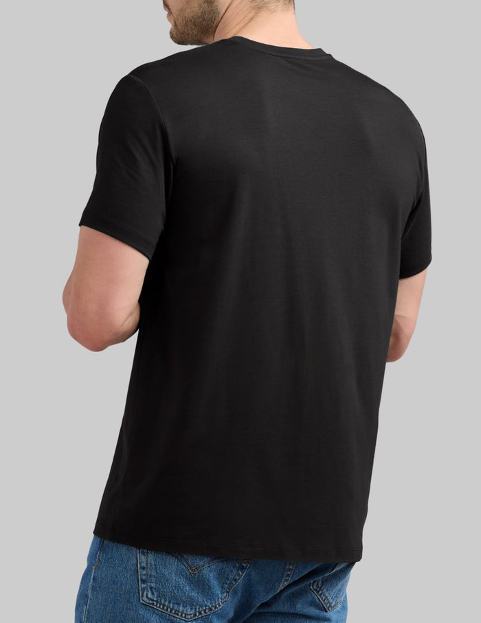 | Back view of model wearing the Men's Relaxed Fit Best Damn Tee highlighting the coverage and fit |  Black
