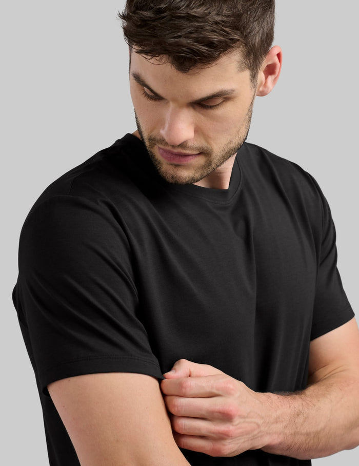 | Front view of model wearing the Men's Relaxed Fit Best Damn Tee highlighting the coverage and fit | Black