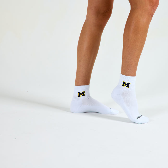 Del Campo Michigan Maize golf socks on a female model in studio