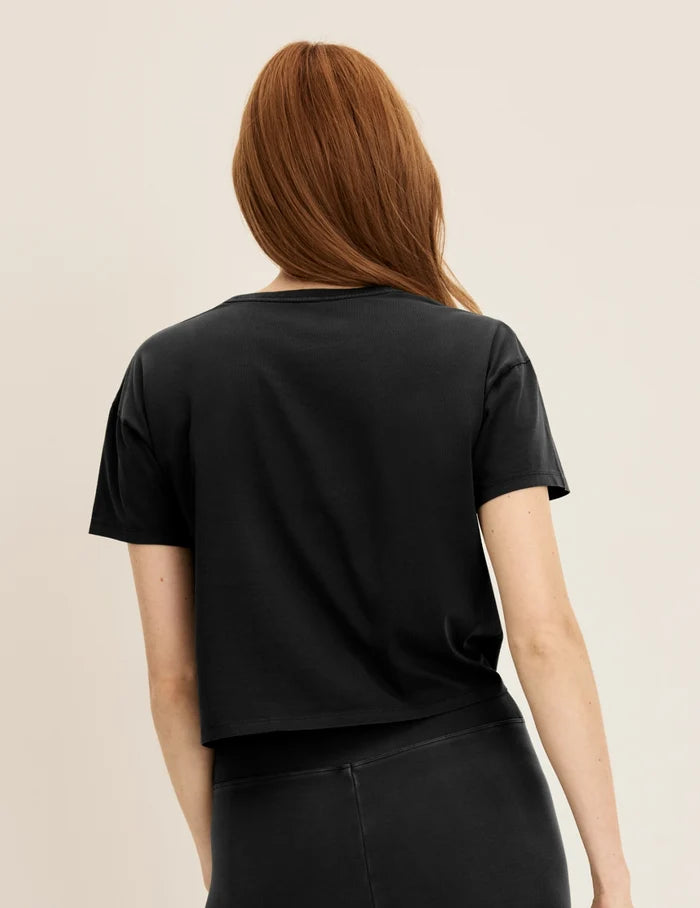 | Back view of model wearing the Mineral-Dyed Cotton T-Shirt highlighting the coverage and fit | Washed Black