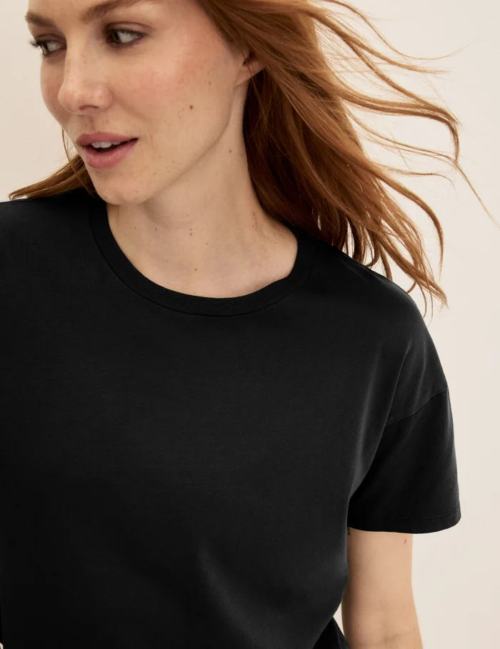 | Front view of model wearing the Mineral-Dyed Cotton T-Shirt highlighting the coverage and fit | Washed Black