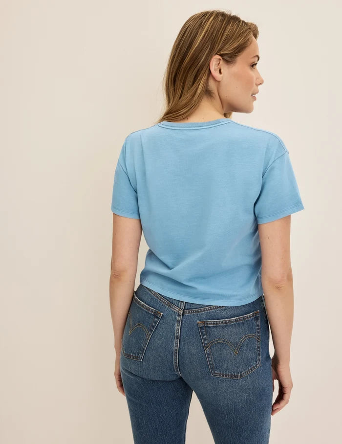 | Back view of model wearing the Mineral-Dyed Cotton T-Shirt highlighting the coverage and fit | Washed Blue Mist
