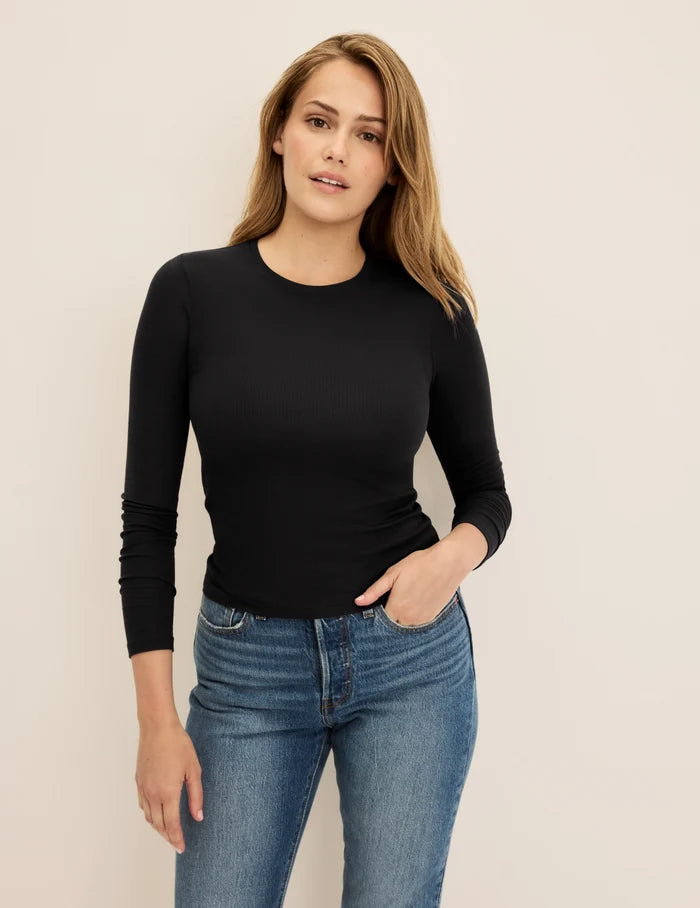 | Front view of model wearing the Modal Rib Long Sleeve highlighting the coverage and fit | Black
