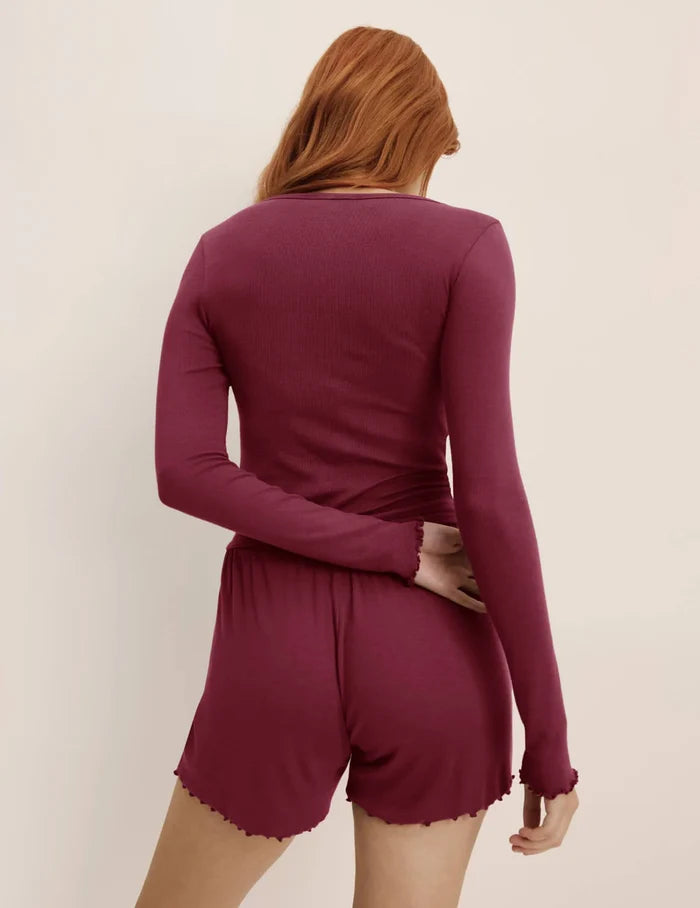 | Back view of model wearing the Modal Rib Short highlighting the coverage and fit | Dark Cherry