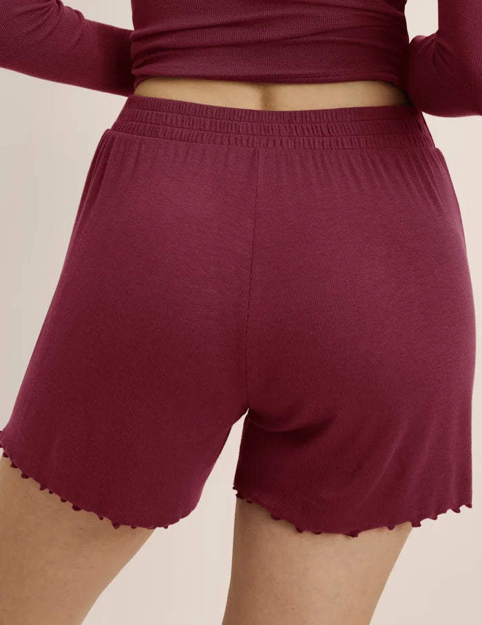 | Back view of model wearing the Modal Rib Short highlighting the coverage and fit | Dark Cherry