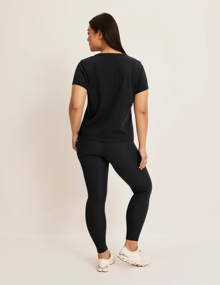 | Back view of model wearing the Modal Ultra Soft Legging highlighting the coverage and fit | Black