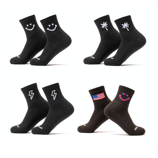 Del Campo Night Mode Pack golf socks featuring all four Night Mode designs: bolt, palm, smiley, and 1776