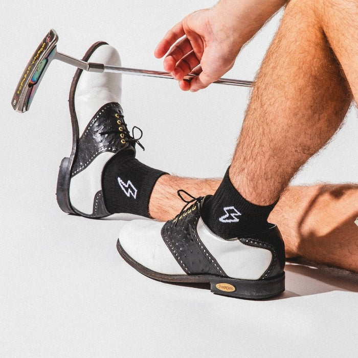 Del Campo Night Mode Pack golf socks featuring all four Night Mode designs: bolt, palm, smiley, and 1776