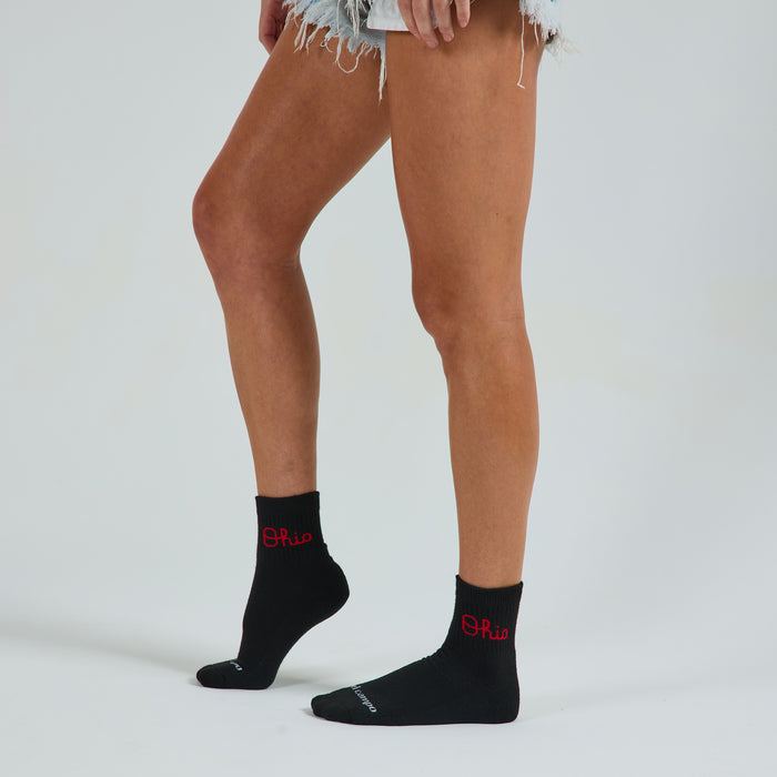 Del Campo Ohio State Night Mode golf socks on a female model in studio