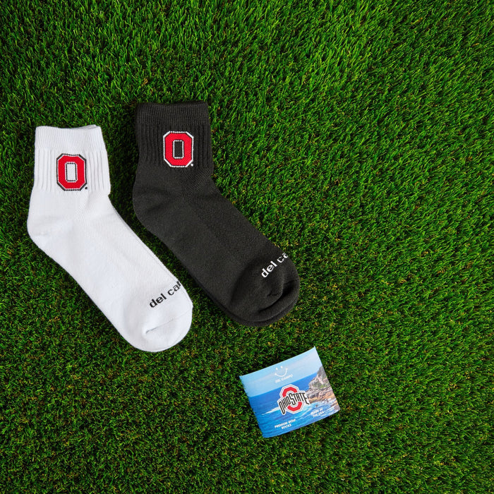 Del Campo Ohio State Pack golf socks on turf with a team pennant
