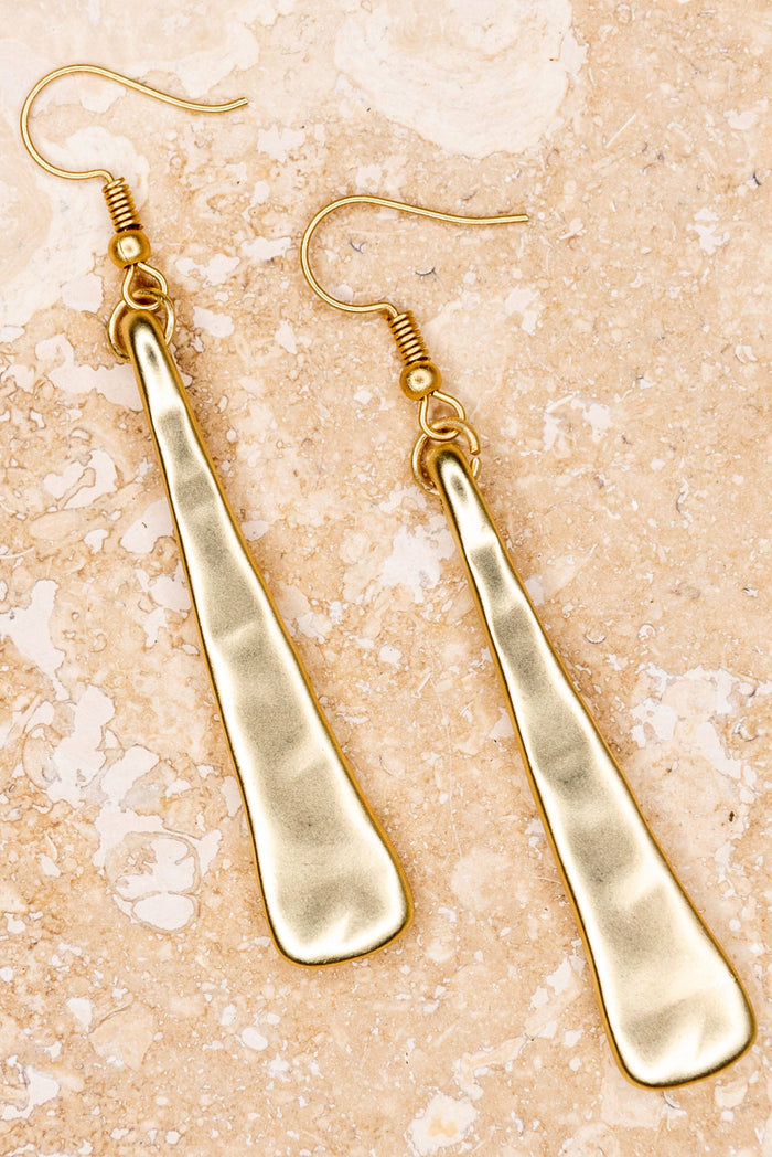 Hammered worn gold long triangle shape fishhook drop earrings.