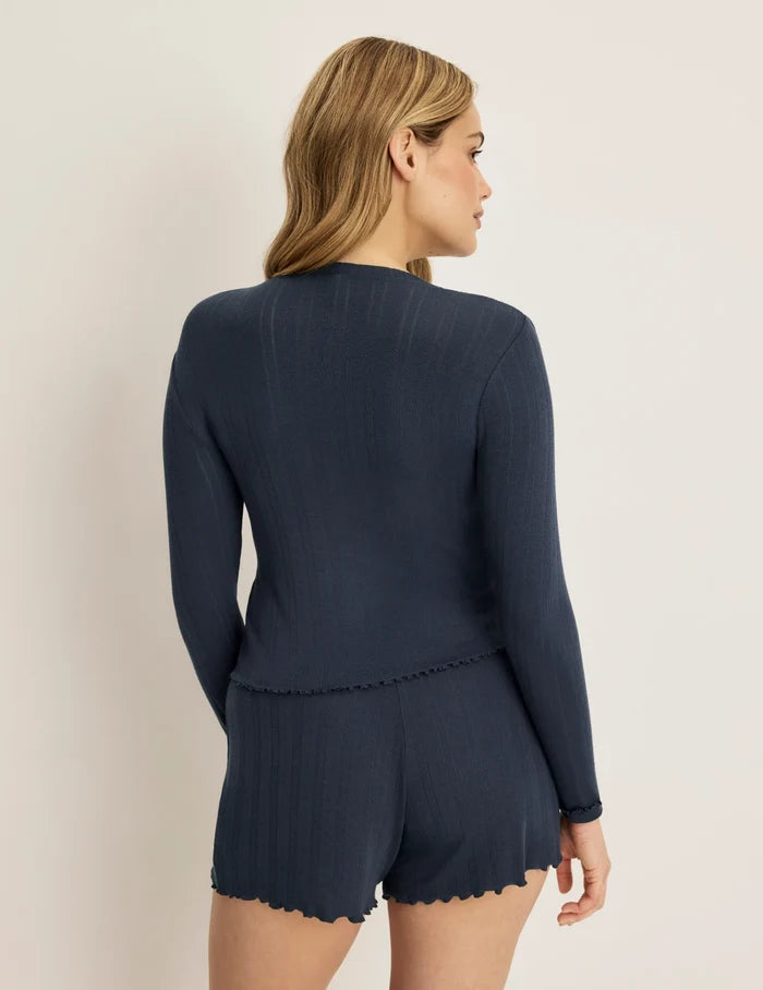 | Back view of model wearing the Pointelle Cardigan highlighting the coverage and fit | Twilight Navy