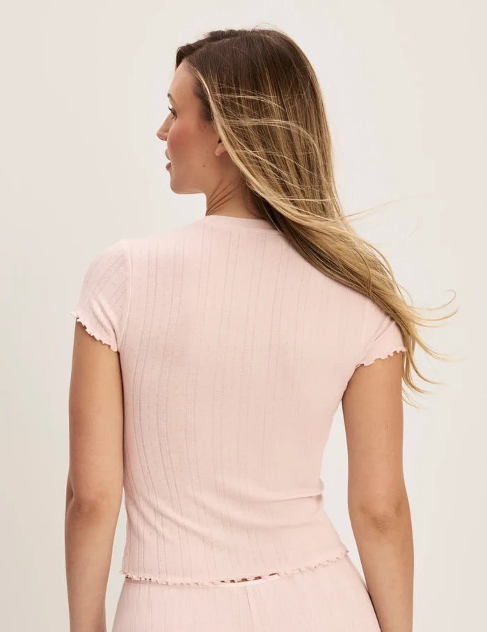 | Back view of model wearing the Pointelle T-Shirt highlighting the coverage and fit | Hush