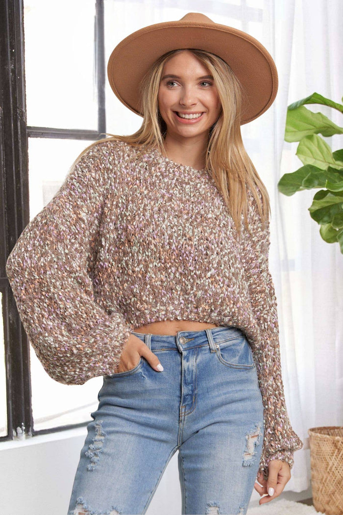 Multi color in light brown and tans with speckles of white, popcorn texture, puffed sleeved, short waisted sweater