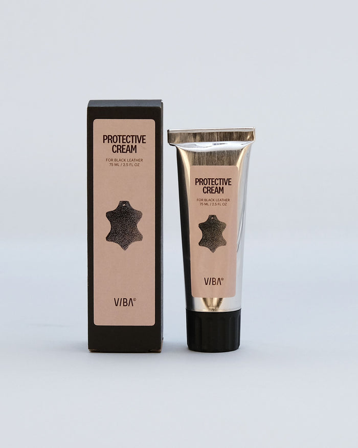 Black protective cream by VIBA in a beige tube with gold cap and matching black box packaging.