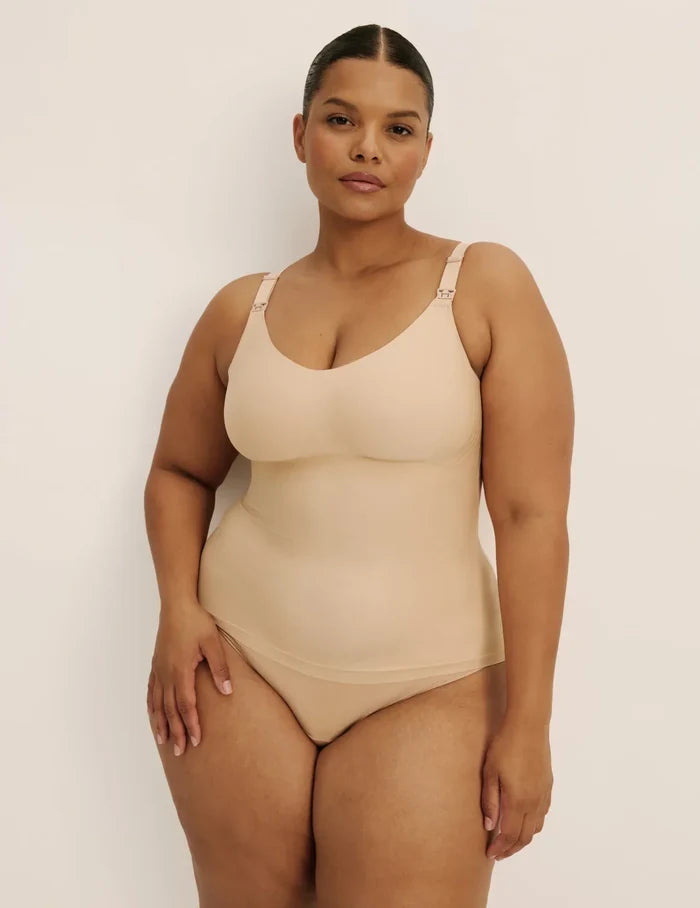 Leslie is a 38D and wearing KNIX XL+ | Front view of model wearing the Revolution Nursing Tank, highlighting the neckline, strap design, and smooth silhouette | Warm Sand