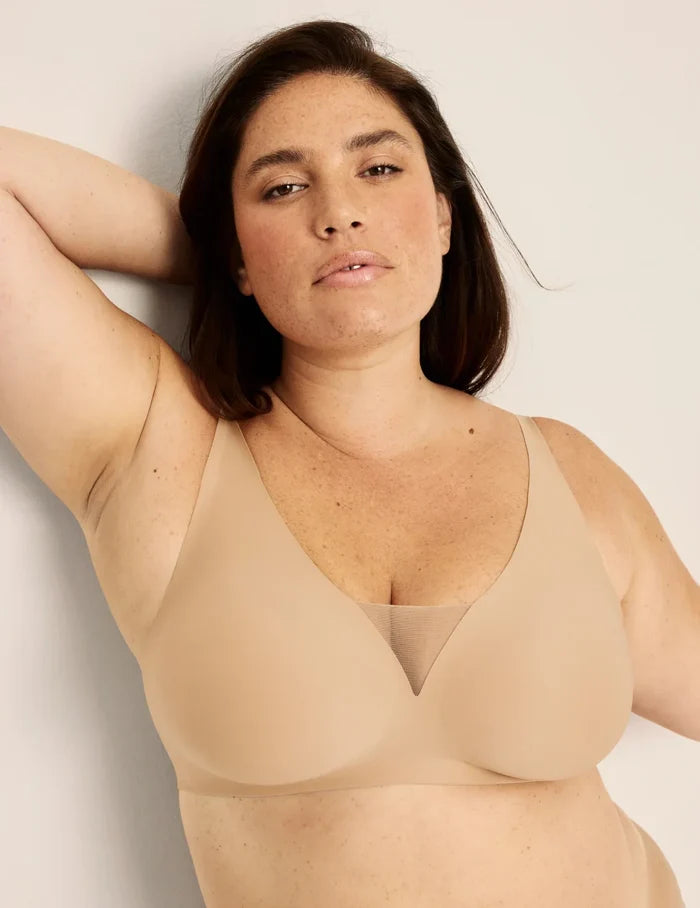 Clementine is a 40G and wearing KNIX XXL++ | Front view of model wearing the Revolution Shadow Mesh Bra, highlighting the neckline, strap design, and  silhouette | Warm Sand