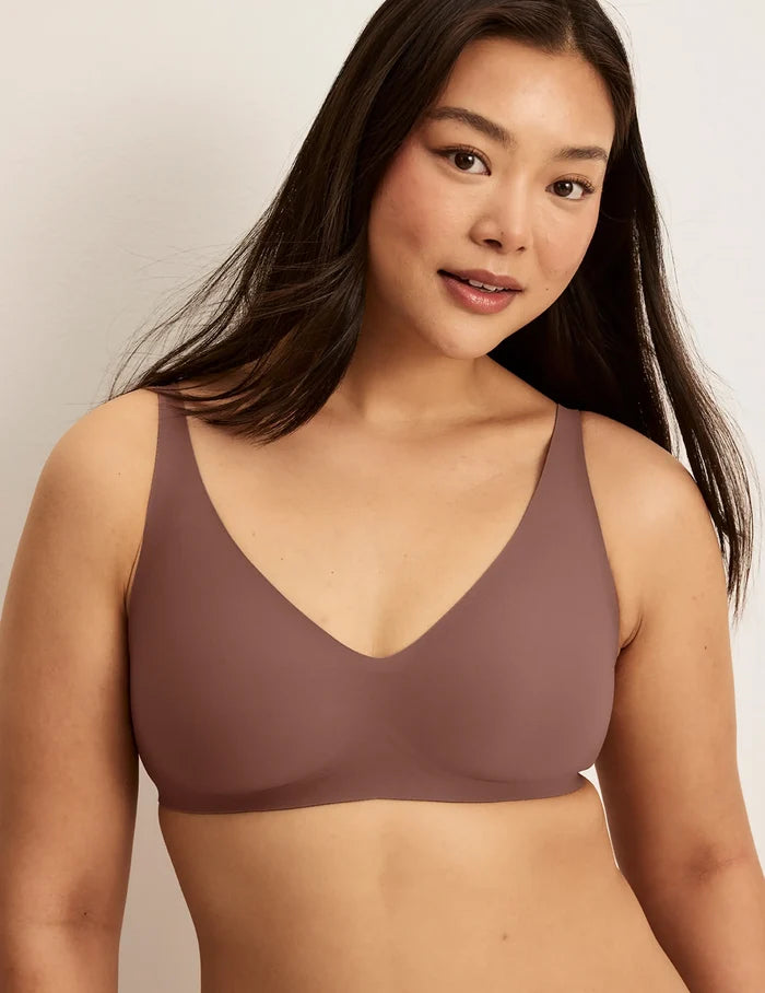 | Front view of model wearing the Revolution V-Neck Bra, highlighting the neckline, strap design, and smooth silhouette | Sola