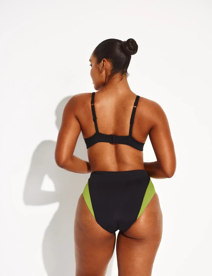 Amber is a 36C and wears a Knix size L | Back view of model wearing the Ruched Deep V Bikini Top, highlighting the neckline, strap design, and silhouette | Black