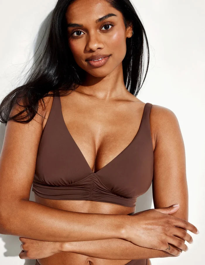 Jay is a 30E wearing KNIX S+ | Front view of model wearing the Ruched Deep V Bikini Top, highlighting the neckline, strap design, and silhouette | Espresso