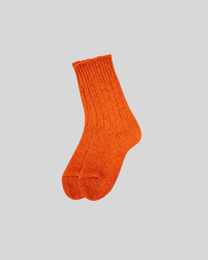 Bright orange ribbed crew sock with scalloped cuff and heel detail.