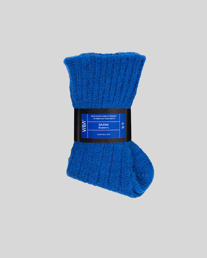Blue ribbed socks with black band label and product information.