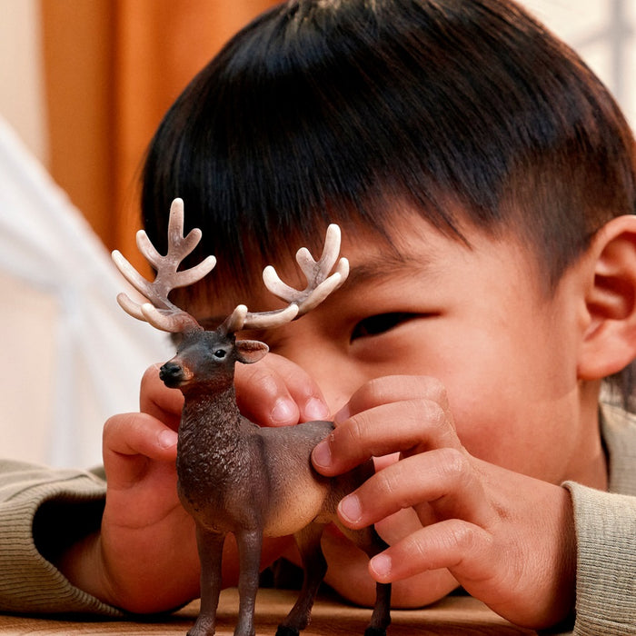 Schleich Elk toy figure held during play