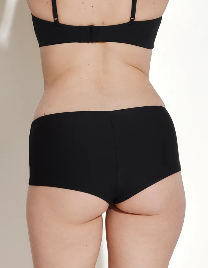 | Back view of model wearing the Sculpt Cheeky Low Rise Swim Bottom highlighting the coverage and fit | Black