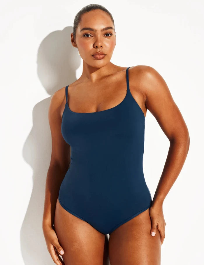 | Front view of model wearing the Sculpt Classic One Piece Swimsuit highlighting the neckline, coverage and fit | Horizon