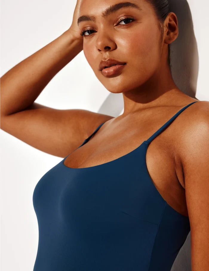 | Front view of model wearing the Sculpt Classic One Piece Swimsuit highlighting the neckline, coverage and fit | Horizon