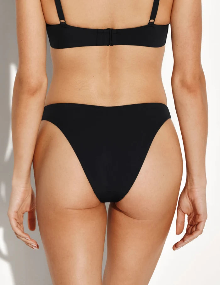| Back view of model wearing the Sculpt Dipped Bikini Swim Bottom highlighting the coverage and fit | Black