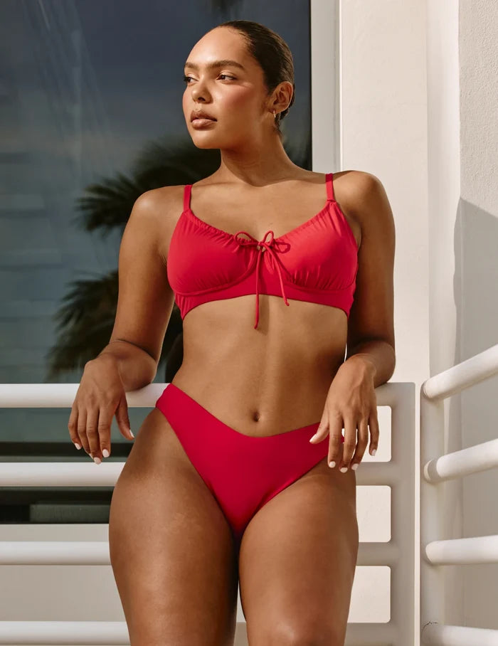 | Front view of model wearing the Sculpt Dipped Bikini Swim Bottom highlighting the coverage and fit | Cherry
