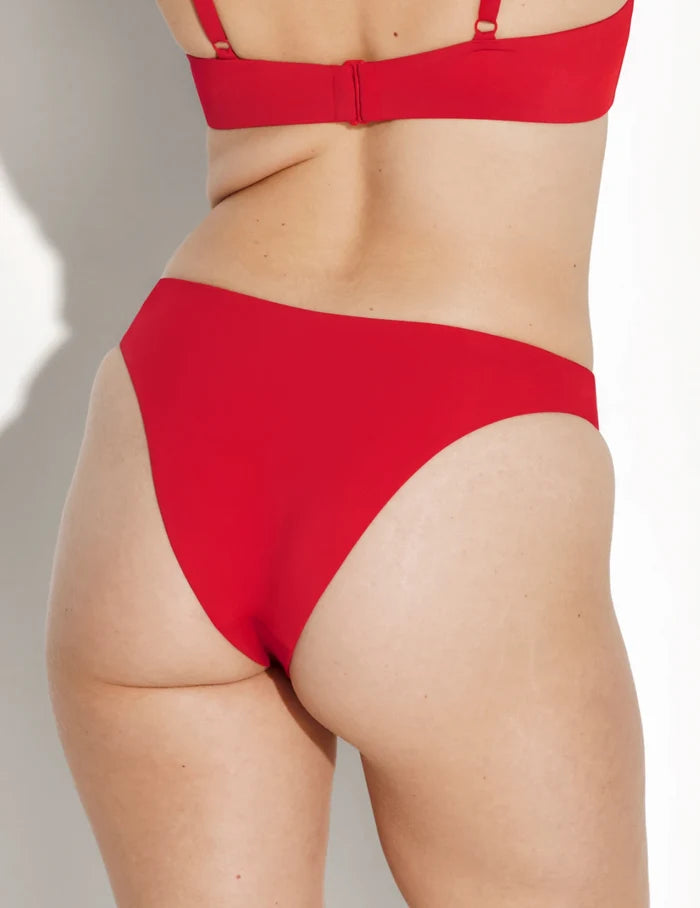 | Back view of model wearing the Sculpt Dipped Bikini Swim Bottom highlighting the coverage and fit | Cherry