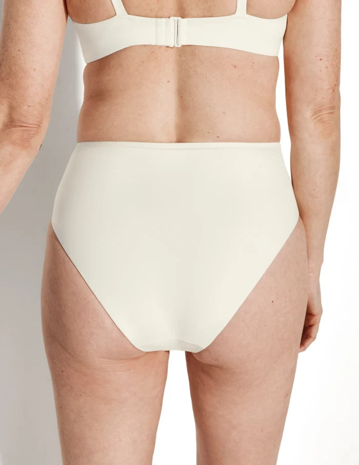 | Back view of model wearing the Sculpt Ruched Bikini Swim Bottom highlighting the coverage and fit | Ivory