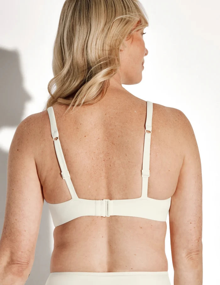| Back view of model wearing the Sculpt Ruched Deep V Bikini Top, highlighting the neckline, strap design, and  silhouette | Ivory