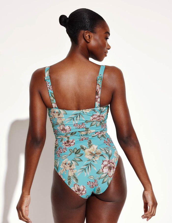 Orlane is a 32DD wearing KNIX M | Back view of model wearing the Sculpt Ruched One Piece Swimsuit highlighting the neckline, sculpt fabric and fit | Lotus