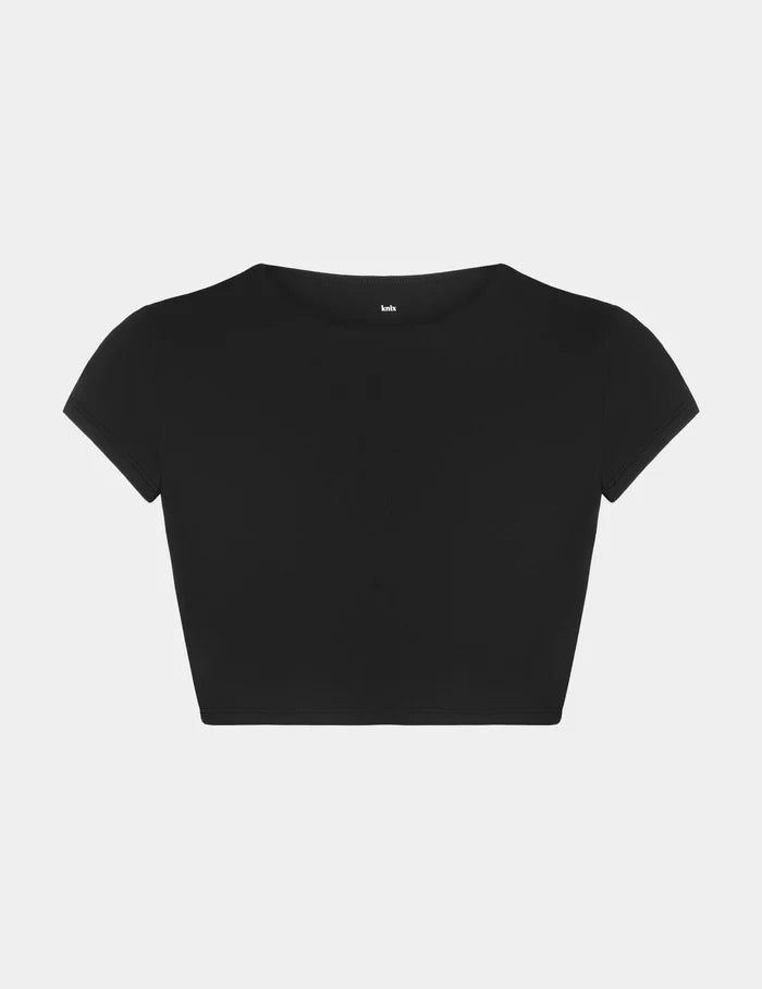 | Sculpt Short Sleeve Swim Top shown front-facing against a light gray background | Black