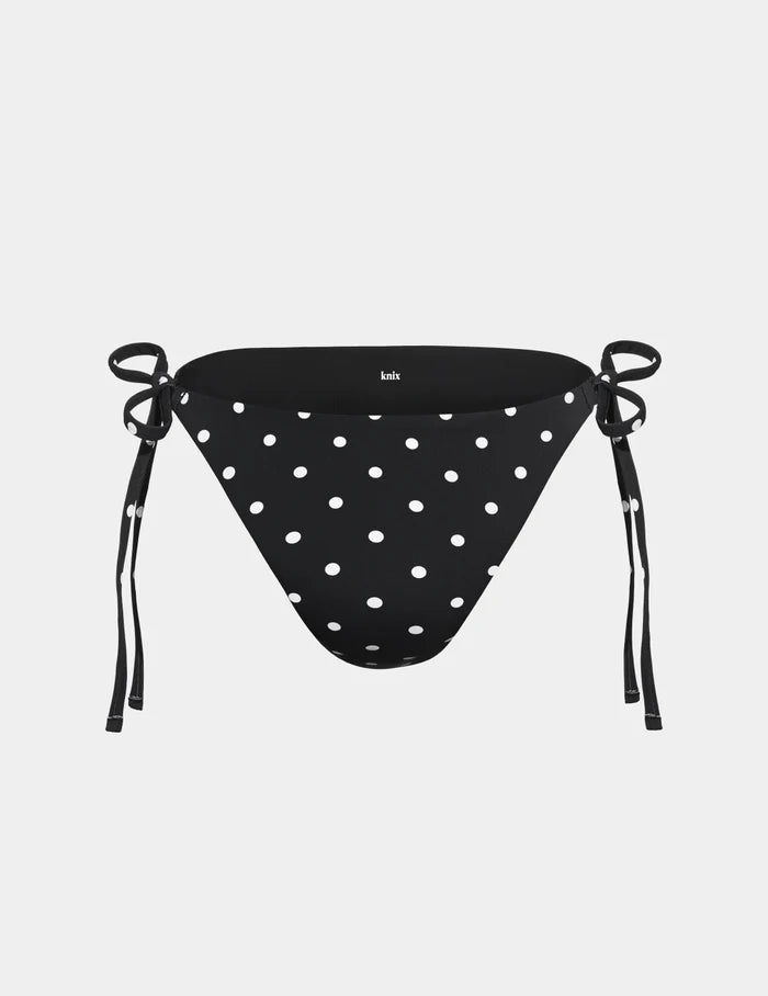 | Sculpt String Bikini Bottom shown front-facing against a light gray background | Black with White Polka Dot