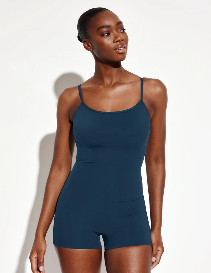 | Front view of model wearing the Sculpt Swim Shortie One Piece highlighting the coverage and fit | Horizon