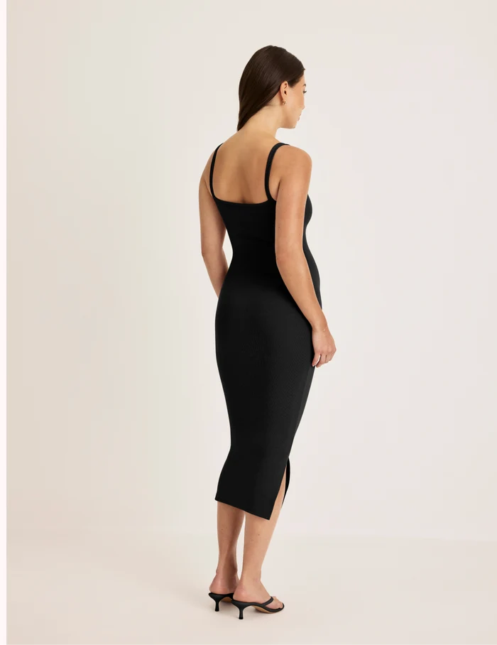 Alexandra is 5’8.5” tall and wearing KNIX S | Back view of model wearing the SculptRib™ Cotton Cami Dress highlighting the neckline, fabric and hugging fit | Black