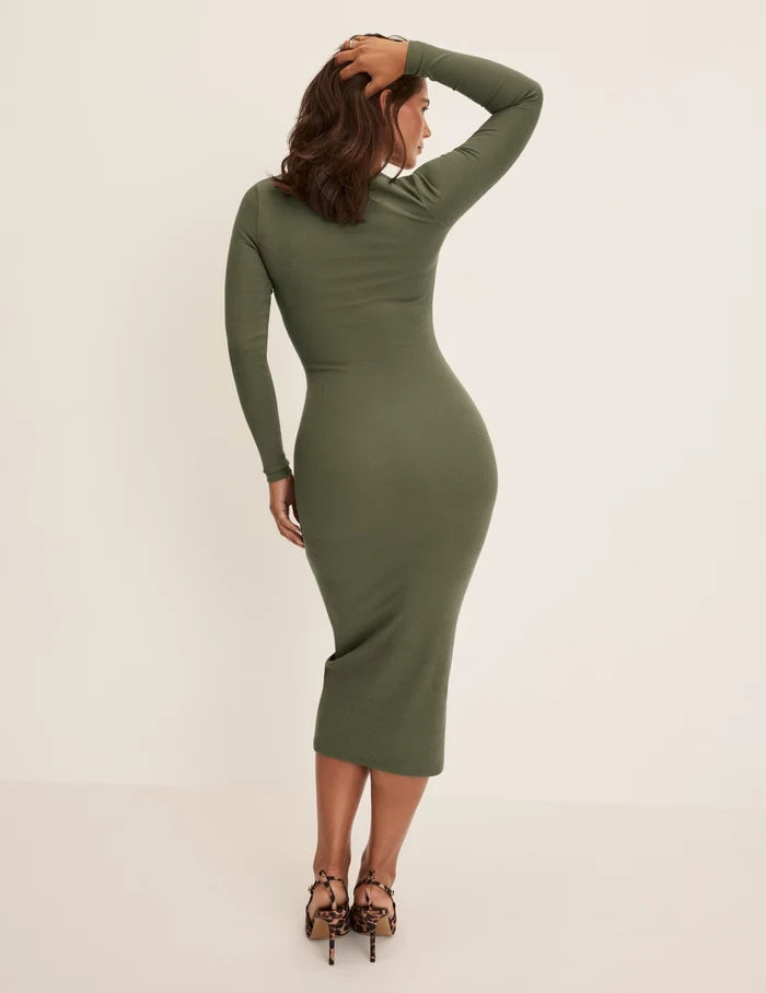 Maya is a 34DDD, 40” hips and wearing KNIX M | Back view of model wearing the SculptRib™ Cotton Henley Dress highlighting the neckline, fabric and hugging fit | Olive
