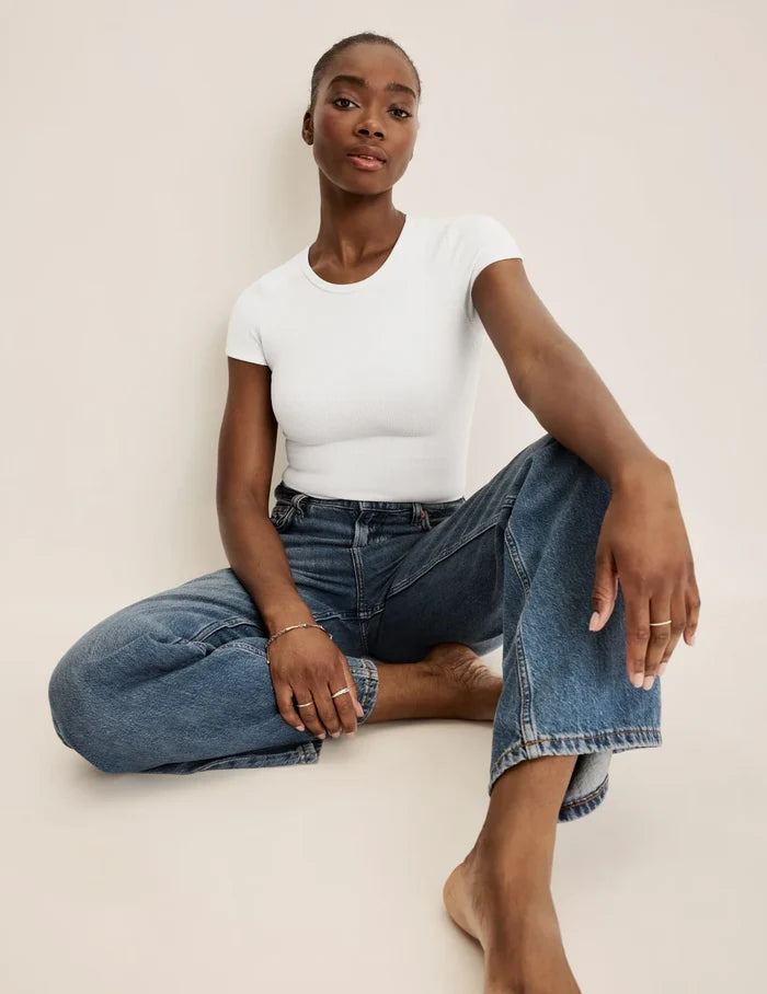Orlane is a 32DD wearing KNIX S | Front view of model wearing the SculptRib™ Cotton T-Shirt highlighting the neckline, fabric and hugging fit | White