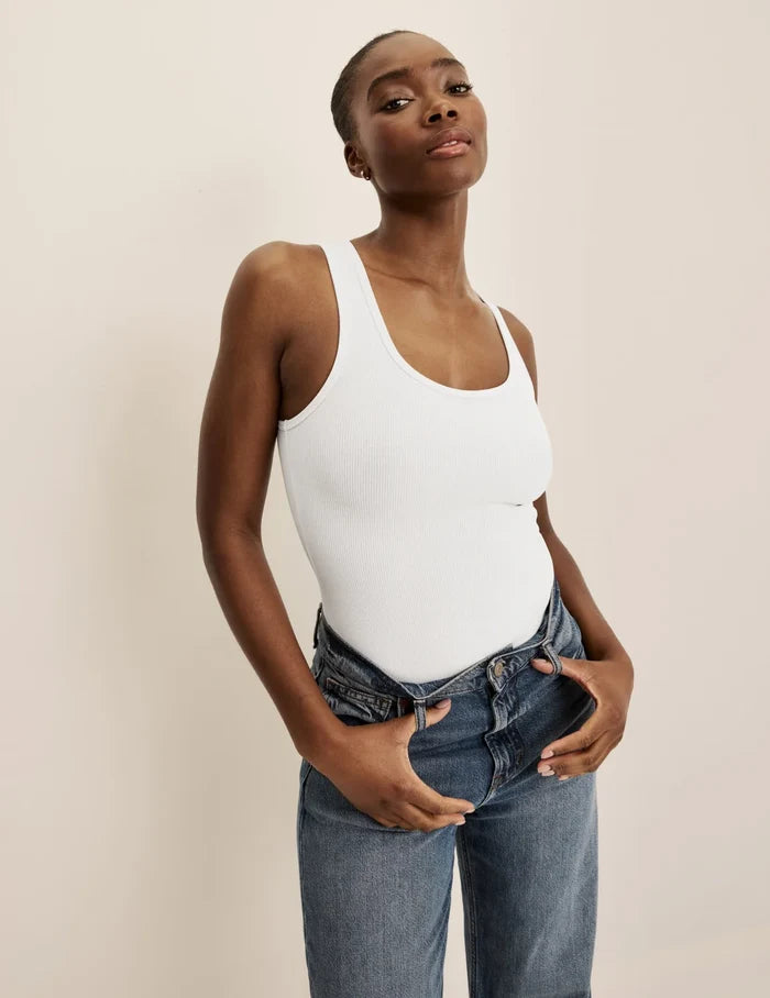Orlane is a 32DD, 5'9" tall and wearing KNIX S | Front view of model wearing the SculptRib™ Cotton Tank Bodysuit highlighting the neckline, fabric and hugging fit | White