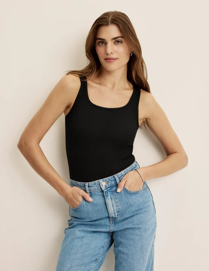 Ashley is a 34C, 5’10” tall and wearing KNIX S | Front view of model wearing the SculptRib™ Cotton Tank Bodysuit highlighting the neckline, fabric and hugging fit | Black