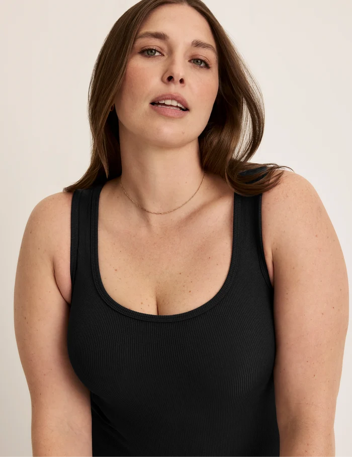 Beatrice is 5’7.5” tall and wearing KNIX XL | Front view of model wearing the SculptRib™ Cotton Tank Dress highlighting the neckline, hemline and hugging fit | Black