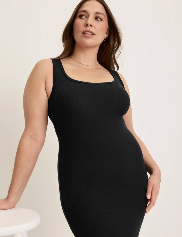 Beatrice is 5’7.5” tall and wearing KNIX XL | Front view of model wearing the SculptRib™ Cotton Tank Dress highlighting the neckline, hemline and hugging fit | Black