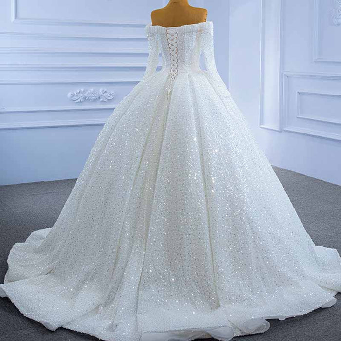 Elegant off the shoulder sequin wedding dress with a voluminous skirt and intricate back detailing