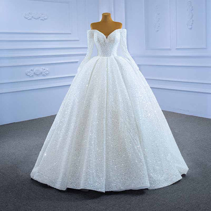 Elegant off the shoulder sequin wedding dress featuring a luxurious full skirt and fitted bodice