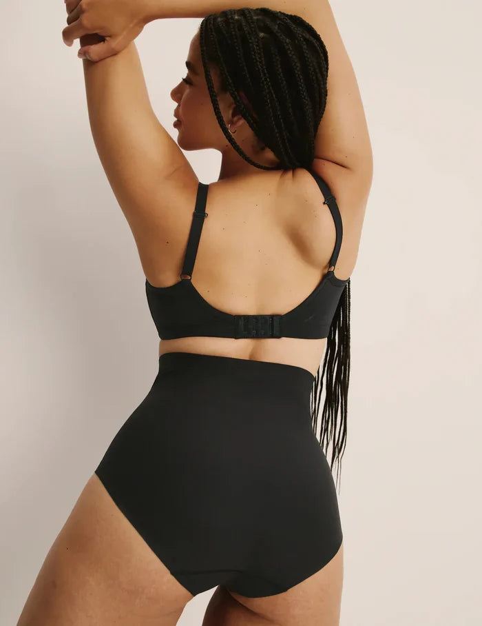 | Back view of model wearing the Shaper High Rise Briefs, highlighting the coverage and smooth fit | Black