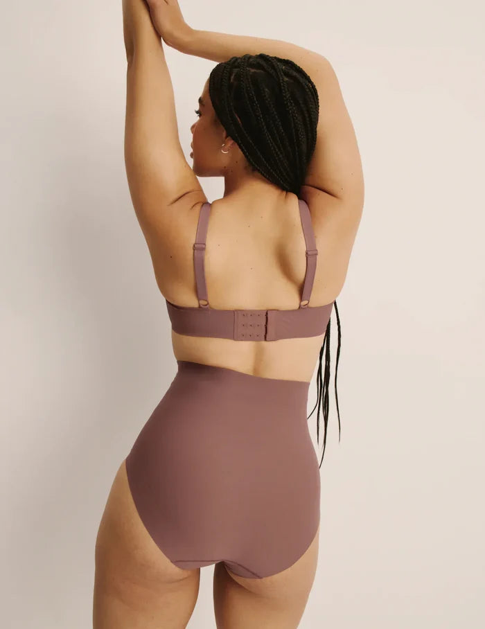 | Back view of model wearing the Shaper High Rise Briefs, highlighting the coverage and smooth fit | Sola